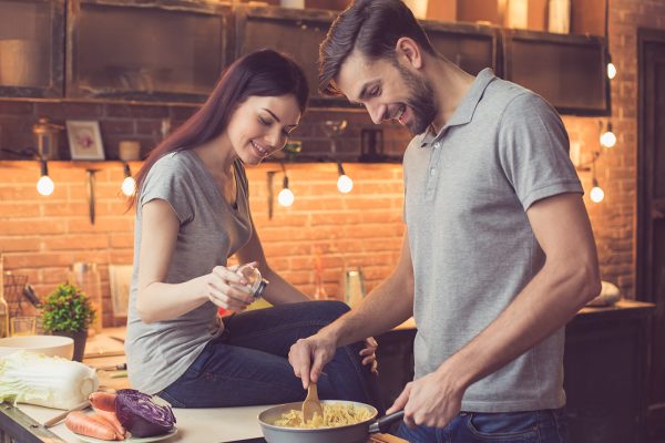 couple-in-the-kitchen-making-food